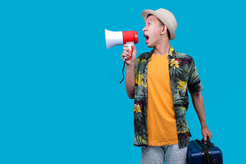 Young Traveler Man In A Hawaiian Shirt And Hat Shouting Into A Megaphone To The Side