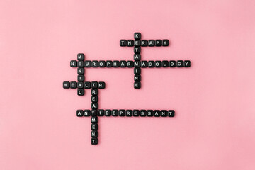 Words neuropharmacology, ketamine therapy and antidepressant made up of black plastic letter blocks...