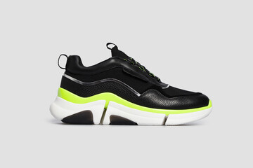 Black sport high thick soled women's basketball shoe, sneaker, sports shoe. Gym, running, training boot for female isolated on white background. Footwear, casual streetwear leather shoe. Template