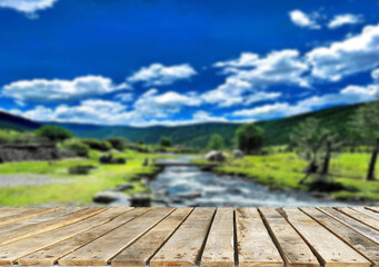 Wooden table top on blur stream water and forest natural background in lagoon or river.For montage product display or design key visual layout.view of copy space.