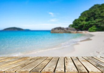 Wooden table top on the beach or sea.Party on the beach  sunshine time concept.For montage product display or design key visual layout.View of copy space.