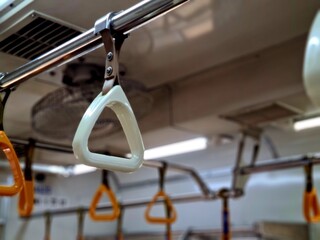 Passenger handgrip handle inside commuter train