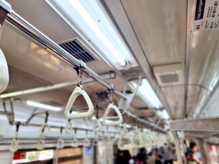 Passenger handgrip handle inside commuter train