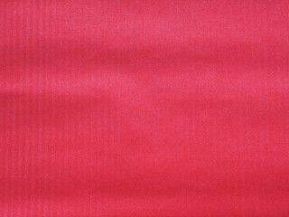 Red paper with vertical lines, red background. Idea for design, text, Valentine's Day.