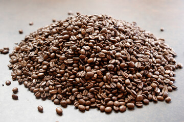 Roasted coffee beans on a black background. Selective focus.