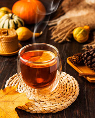 cup of tea with autumn leaves