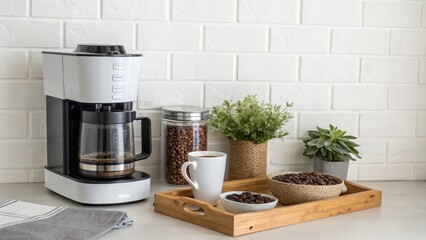 charming and organized coffee station on a kitchen counter. Features a modern coffee maker, a container of coffee beans, a white mug, and a small plant. This "micro" scene is perfect for blogs, websit
