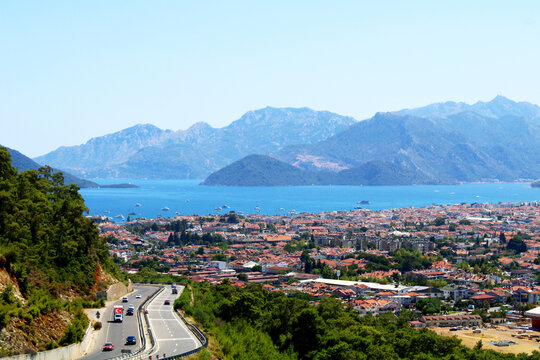 Scenic coastal Marmaris town nestled between mountains and the sea under a clear blue sky. Mugla,Turkey.
