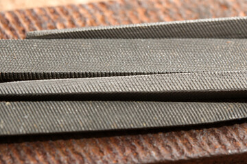 Tools of craftsmanship captured in intricate detail on aged wood