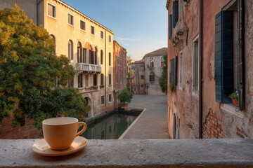 imagine peaceful morning in venice where you savor your coffee on charming balcony