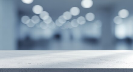 A blurred background with a white surface in the foreground and bokeh lights in the distance