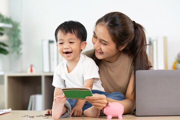 Financial Empowerment. Mother and child sharing joyful moments while learning about money.