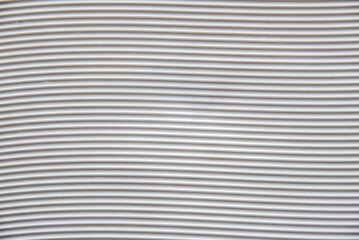 Obraz premium White plastic base with grooves forming horizontal waves