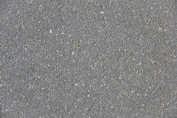 Macro background of detail of worn and dirty asphalt