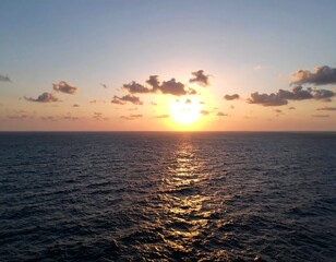 Naklejka premium Sunset over a vast ocean