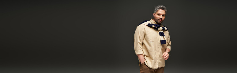 Stylish pose of a handsome man showcasing trendy fashion in a modern studio setting