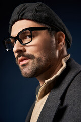 Obraz premium Stylish man in elegant outfit showcases modern fashion in studio environment