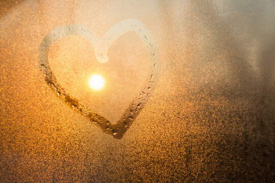 Heart drawn on a steamy window
