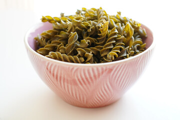 Health Food Concept , Gluten-free pasta made from seaweed in a bowl on a white background