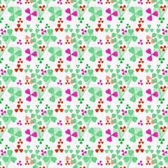 Seamless pattern of vibrant green magenta and red three leaf clover like shapes on a textured white background
