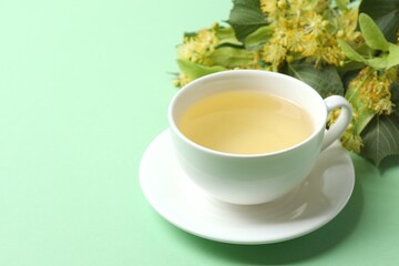 Healthy linden or tilia flower tea in the cup