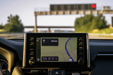 GPS navigation system inside car with highway view