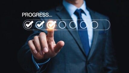 Obraz premium Businessman's finger activating progress bar with completed tasks, marking success and achievement