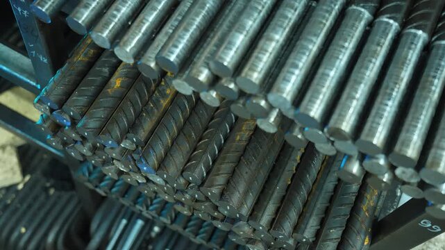 Stack of steel reinforcement bars in warehouse