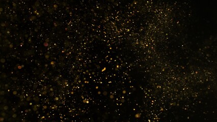 Freeze Motion Shot of Golden Glitter Background Isolated on Black