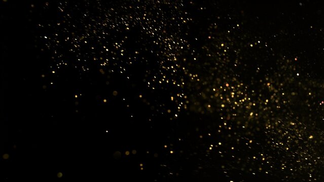 Freeze Motion Shot of Golden Glitter Background Isolated on Black - Powered by Adobe
