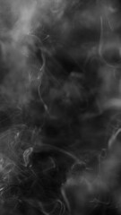 Detail Shot of Atmospheric Smoke Slowly Floating on Black Background