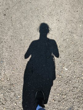 Shadow person pavement
