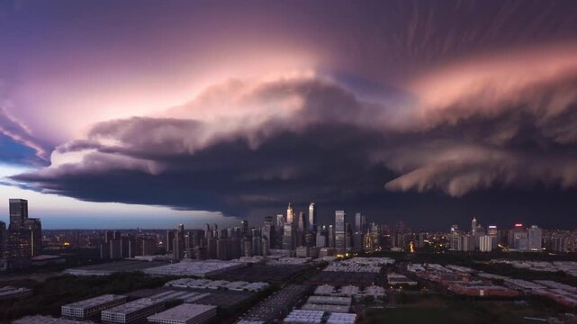 Massive shelf cloud advancing over metropolitan skyline during vibrant sunset, casting threatening shadow and highlighting intense atmospheric dynamics of severe weather phenomenon