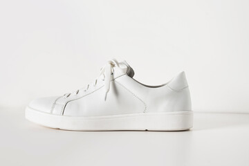 New white sneaker isolated on white background. Creative shoes modern style, fashion concept. Summer womens footwear. Copy space.