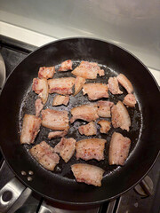 Pork belly in the frying pan.