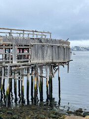 Old wooden pier on the Barents Sea coast, Teriberka, Russia