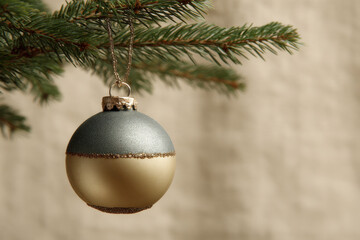 minimalist christmas celebration in usa featuring simple yet elegant tree adorned with single ornament