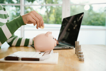 A person saves money in a piggy bank, symbolizing financial planning, investment, budgeting, and...