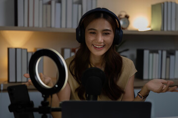 Virtual Meeting Dynamics. Woman smiling while gesturing during an online discussion.