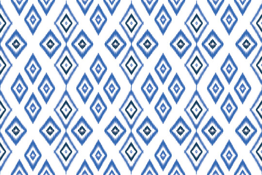 Seamless blue Ikat diamond pattern. Traditional ethnic textile style in indigo tones, perfect for fabric, fashion, wallpaper, wrapping paper, and decor.