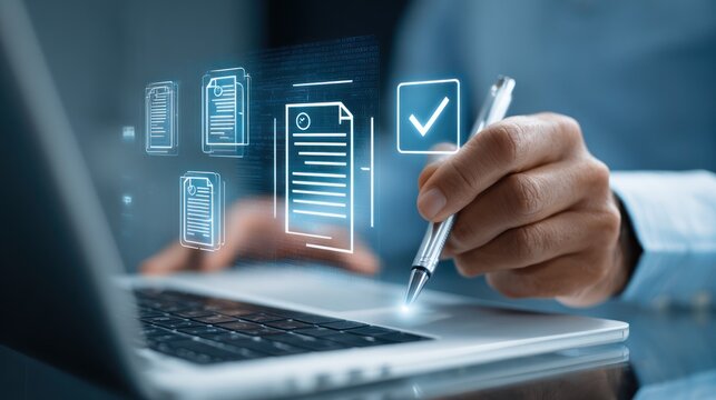 Digitized documents over laptop, hand with pen
