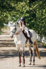 Girl Bonding with White Horse