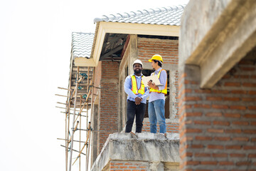 Engineering inspect construction site : construction worker Architects and contractor working...