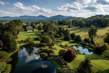 Panoramic view of countryside estate with manor, rolling hills, ponds, and gardens