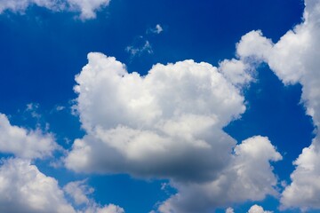 The white cloudscape in the bright blue sky.