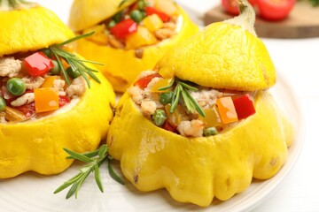 Tasty stuffed pattypan squashes on white table, closeup