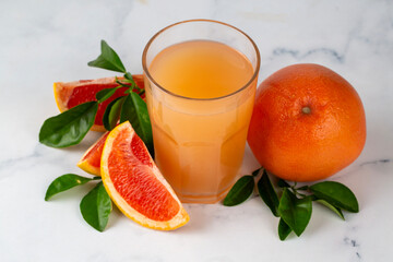 Tasty freshly made grapefruit juice and fruit