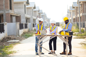 Engineering inspect construction site : construction worker Architects and contractor working together inside building under construction site. Engineering in safety harthat helmet. Engineering team
