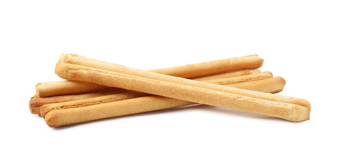 Many delicious grissini sticks isolated on white