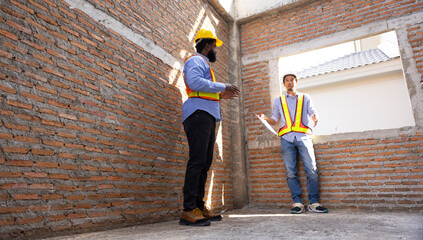 interior design : Architects and contractor working together inside building under construction...